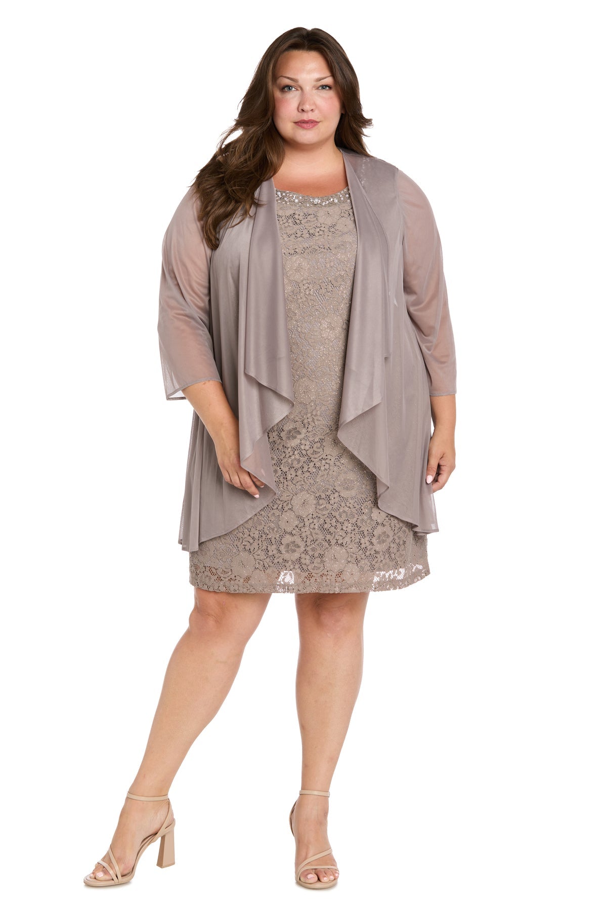 A woman wears the R&M Richards 3594W Plus-Size Short Jacket Dress in taupe with a matching sheer jacket and nude heels, standing facing forward against a white background.